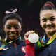 Balance beam bronze medalist Simone Biles and silver medalist Lauren Hernandez of the United States pose for photographs after the medal ceremony for that event at the Rio de Janeiro Olympics on Aug. 15, 2016.
Laurence Griffiths/Getty Images